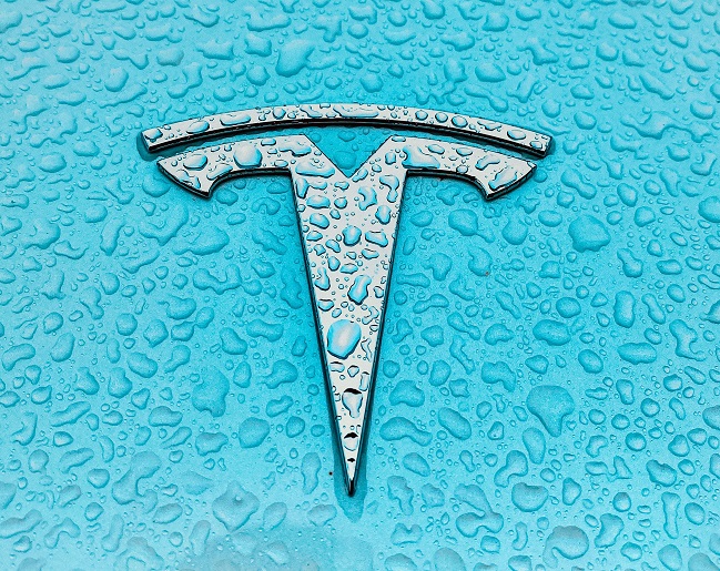 Tesla logo over cian